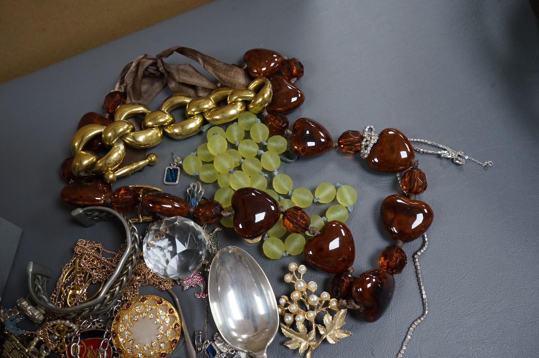 A quantity of assorted recent costume jewellery and two silver handled button hooks.